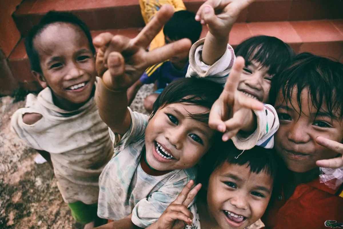 Children and volunteers serving together